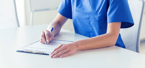 Medical professional writing a report